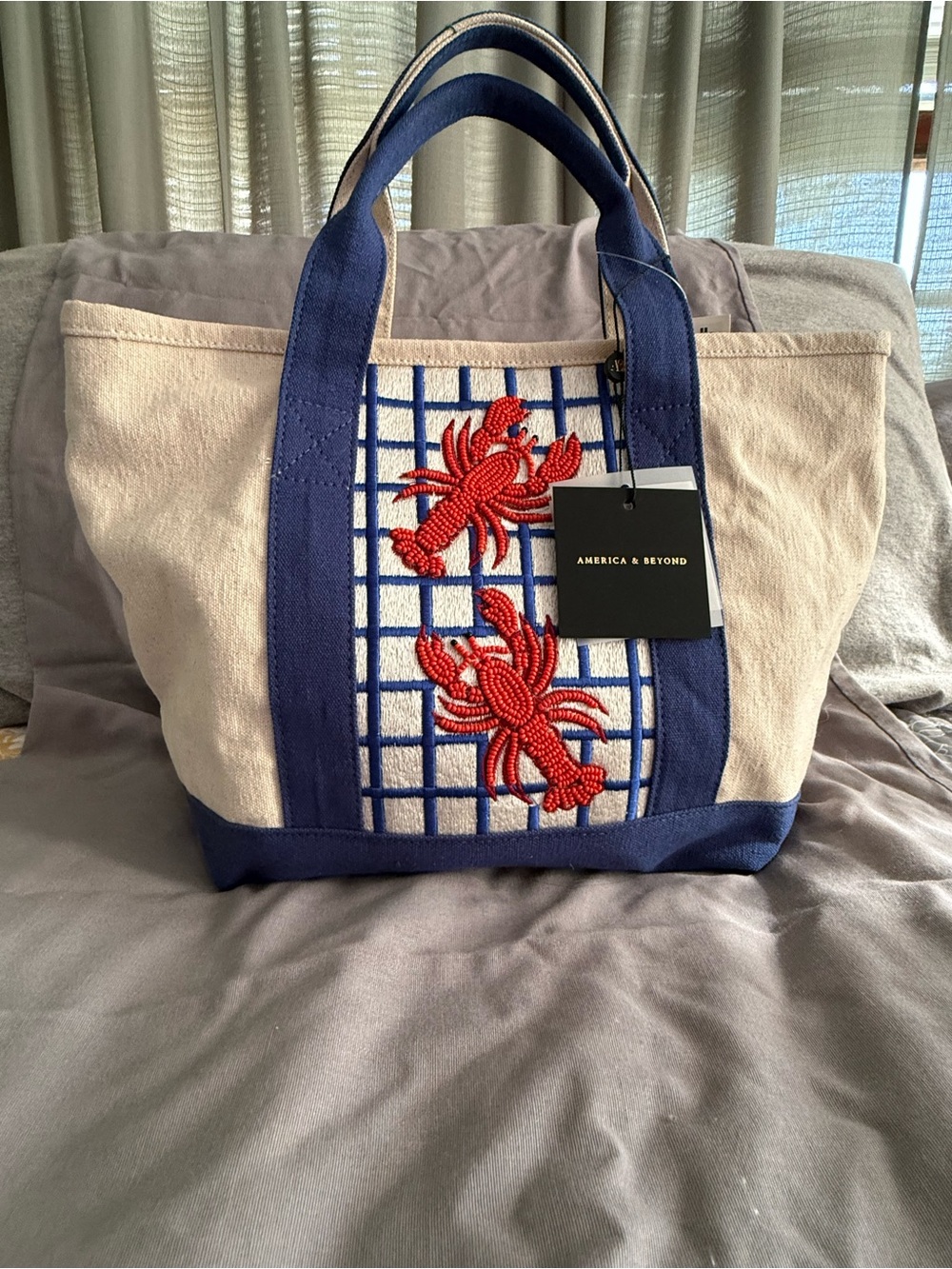 America & Beyond Beige Canvas Tote with Navy Trim and Red Crab Embroidery